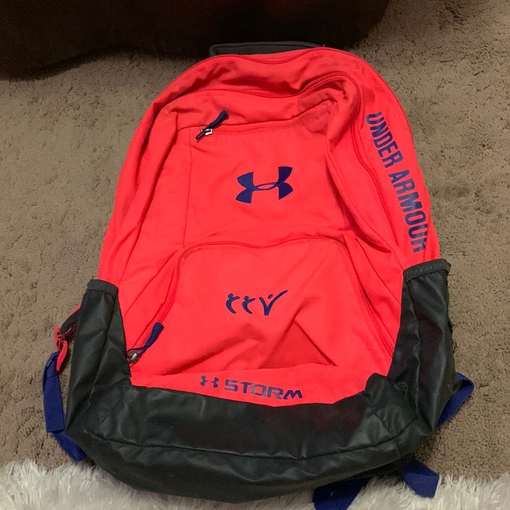 pink, blue, and grey UnderArmour backpack
